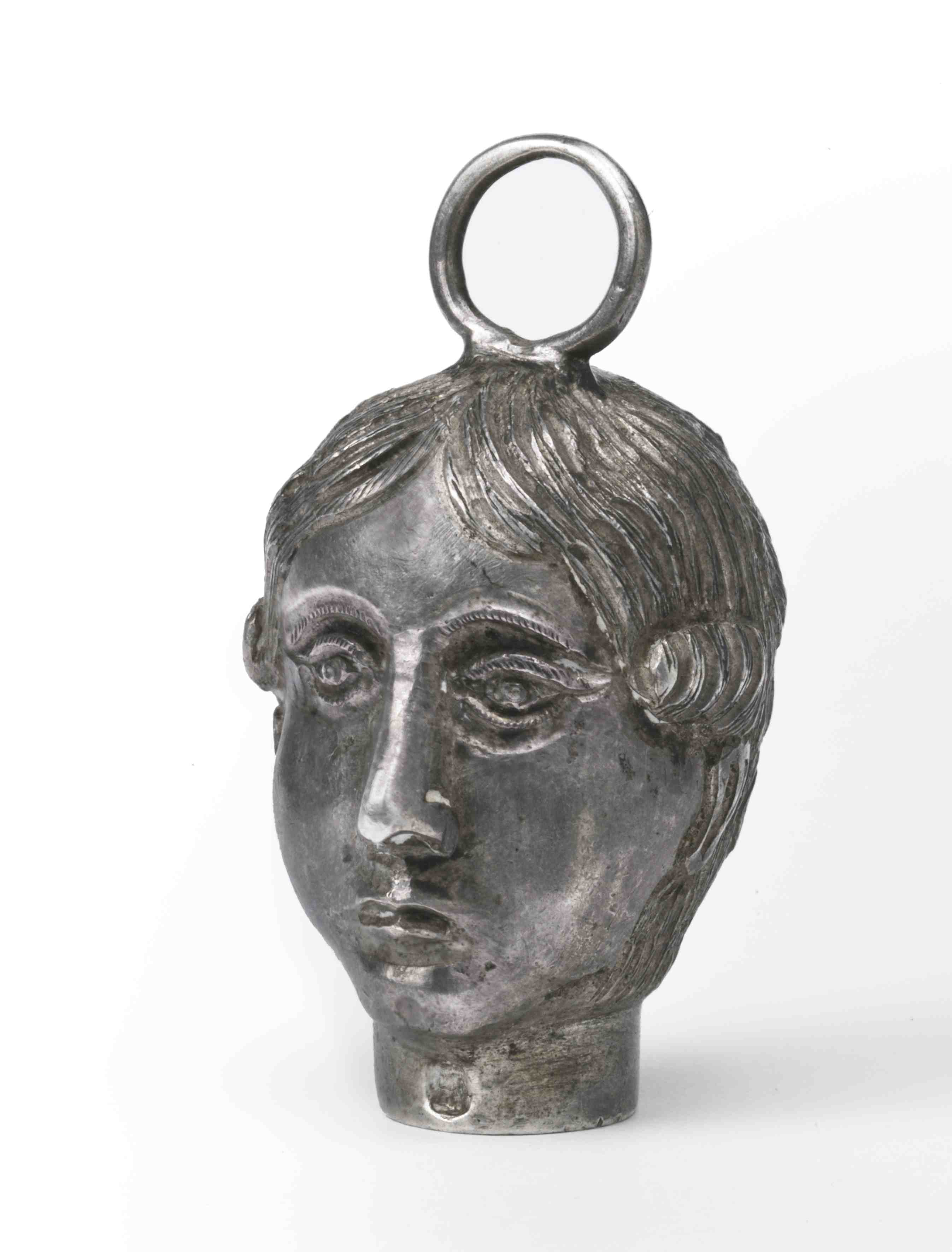 Ex-voto in the form of female head